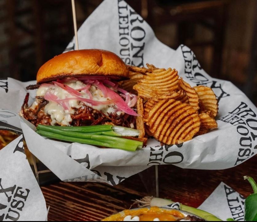 Burger and fries served on custom printed greaseproof paper